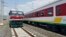 FILE - Locomotives for the new Ethiopia to Djibouti electric railway system queue outside a train station in the outskirts of Addis Ababa, Sept. 24, 2016.