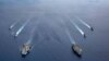 ຮູບພາບເຜີຍເແຜ່ໂດຍກອງທັບເຮືອສະຫະລັດ ທີ່ເຫັນກຳ​ປັ່ນ​ລົບ USS Ronald Reagan (CVN 76) ແລະ​ກຳ​ປັ່ນ​ລົບ USS Nimitz (CVN 68) ​ໃນ​ກຸ່ມກຳປັ່ນໂຈມຕີ ຢູ່ທະເລຈີນໃຕ້ ວັນທີ 6 ກໍລະກົດ 2020.