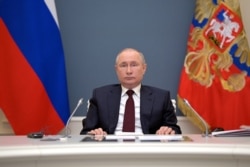 Russian President Vladimir Putin attends a virtual global climate summit via a video link in Moscow, Russia, April 22, 2021.