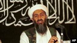 In this 1998 file photo made available on March 19, 2004, Osama bin Laden is seen at a news conference in Afghanistan. 