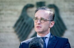 FILE - German Foreign Minister Heiko Maas addresses the media during a statement at the foreign ministry in Berlin, Germany, June 3, 2020.