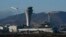 FILE - A plane takes off behind the air traffic control tower at San Francisco International Airport, in San Francisco, California, Nov. 24, 2020.