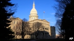FILE - The state Capitol building stands on Dec. 12, 2012, in Lansing, Mich. In 2023 legislative approval was given to allocate money for a factory planned by Chinese manufacturer Gotion in northern Michigan that proponents say will create thousands of jobs. 