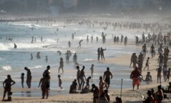 FILE - Beachgoers flock to Ipanema beach amid the coronavirus outbreak in Rio de Janeiro, Brazil, June 21, 2020.