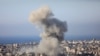 Smoke rises over buildings during an Israeli strike on Beirut's southern suburbs on November 14, 2024, amid the ongoing war between Israel and Hezbollah.