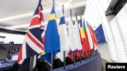 FILE - The British flag and others flags from EU countries are pictured at the European Parliament in Strasbourg, eastern France.