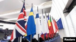 FILE - The British flag and others flags from EU countries are pictured at the European Parliament in Strasbourg, eastern France, Dec.13, 2017.