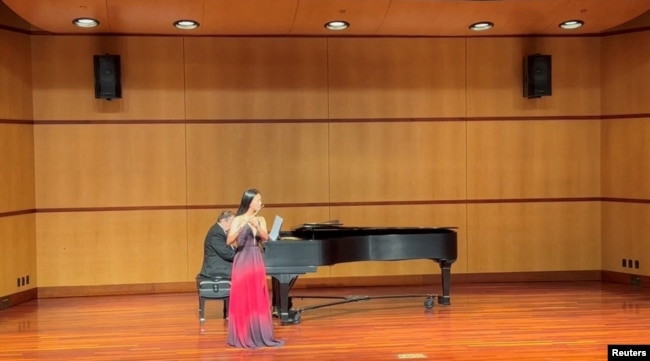 Nina Huang plays the flute at a charity concert at Santa Clara University?s recital hall in Santa Clara, California, U.S., in this April 2022 handout photo. (Xia Liu/Handout)