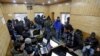 Journalists use the internet as they work inside a government-run media center in Srinagar, Jan. 10, 2020.