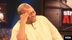 Ghana's Vice President John Dramani Mahama shares a laugh during the interview