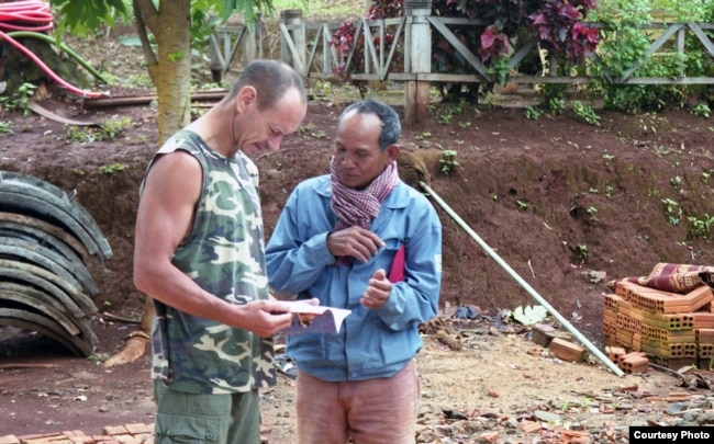 ​Dr. Sylvain Vogel, left, professor of Sanskrit and linguistics at the Royal University of Fine Arts, and independent researcher on Bunong language. (Courtesy photo of Peter Maguire)