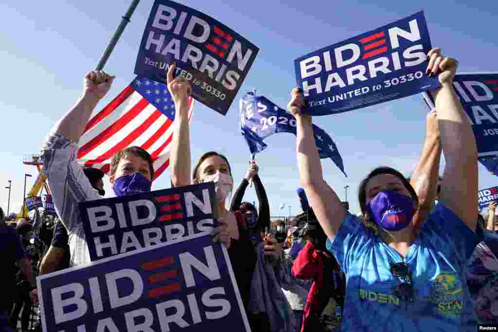 Supporters of Democratic U.S. presidential nominee Joe Biden celebrate near the site of his planned election victory celebration in Wilmington, Delaware.