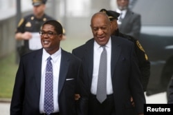 Actor and comedian Bill Cosby arrives with his publicist Andrew Wyatt for jury selection for his sexual assault trial at the Montgomery County Courthouse in Norristown, Pennsylvania, April 4, 2018.