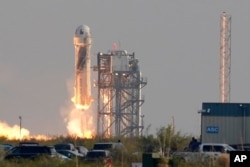 Blue Origin's New Shepard rocket launches carrying passengers Jeff Bezos, founder of Amazon and space tourism company Blue Origin, brother Mark Bezos, Oliver Daemen and Wally Funk, from its spaceport near Van Horn, Texas, Tuesday, July 20, 2021. (AP…