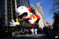 This balloon is a character from the "Diary of a Wimpy Kid" series. It was part of the 92nd annual Macy's Thanksgiving Day Parade in New York, Nov. 22, 2018. (AP Photo/Eduardo Munoz Alvarez)