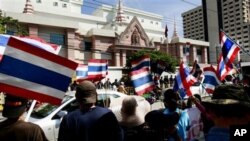 In October 2009, Thai activists wave Thai flags and chant slogans during a rally against Prime Minister Hun Sen's decision to make ousted Prime Minister Thaksin Shinawatra his economic adviser, and the recent protest may just worsen the already tense rela