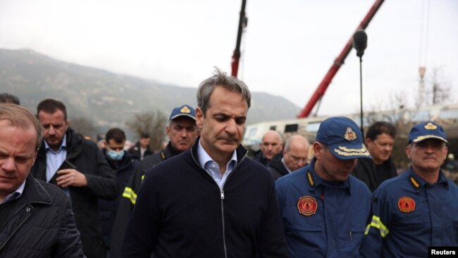 Greek Prime Minister Kyriakos Mitsotakis visits the site of a crash, where two trains collided, near the city of Larissa, Greece, March 1, 2023. REUTERS/Alexandros Avramidis