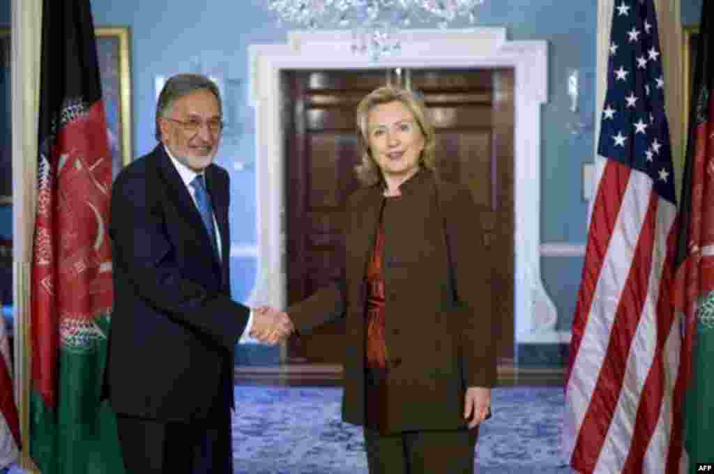 Secretary of State Hillary Rodham Clinton greets Afghan Foreign Minister Zalmay Rassoul at the State Department in Washington, Wednesday, Nov. 17, 2010. (AP Photo/Kevin Wolf)