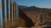 A plastic bottle lies in the sand near the border wall on the US-Mexico border, as seen from Ciudad Juarez, Mexico Oct. 23, 2024.