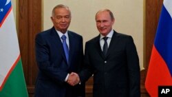 O'zbekiston rahbari Islom Karimov, Rossiya Prezidenti Vladimir Putin ShHTning Dushanbedagi sammitida. 11-sentabr, 2014-yil.