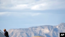 FILE - Then-presidential candidate Donald Trump walks to his plane after speaking during a campaign rally in Grand Junction, Colo., Oct. 18, 2016. The Bureau of Land Management announced plans Tuesday to move its office from Washington to Colorado. 