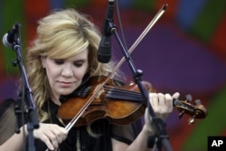 FILE - Alison Krauss & Union Station perform at the New Orleans Jazz and Heritage Festival in New Orleans, April 30, 2015.