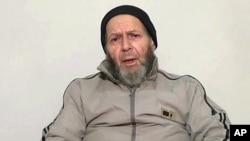 An image made from video released anonymously to reporters in Pakistan on Dec. 26, 2013 shows 72-year-old American development worker Warren Weinstein, who was kidnapped by al-Qaida, appealing to President Obama to negotiate his release.