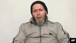 FILE - An image made from video released anonymously to reporters in Pakistan on Dec. 26, 2013 shows 72-year-old American development worker Warren Weinstein, who was kidnapped by al-Qaida, appealing to President Obama to negotiate his release.