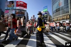 ဂျပန်နိုင်ငံ တိုကျိုမြို့က စစ်အာဏာ ဆန့်ကျင်ဆန္ဒပြပွဲ မြင်ကွင်း။ (ဖေဖော်ဝါရီ ၁၄၊ ၂၀၂၁)