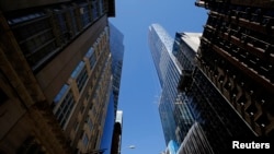 FILE - One57, a new luxury skyscraper apartment building under construction on New York City's West 57th street, April 24, 2014. In places like New York, Miami and London, Chinese investors are dominating the market for land and buildings, especially in the luxury sector. 