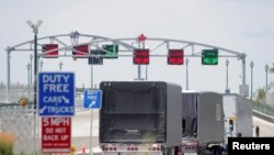 Trucks prepare to cross the Peace Bridge, which runs between Canada and the United States, over the Niagara River in Buffalo, New York, July 15, 2020.