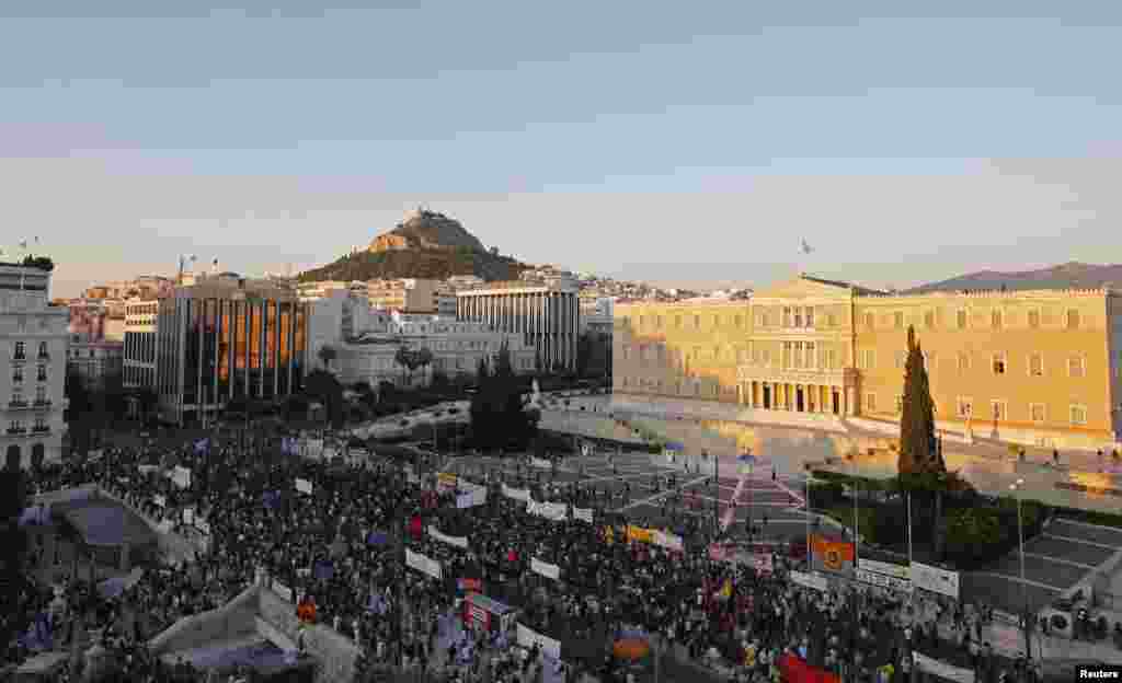Protesters gather in front of the Greek Parliament during an anti-austerity rally organized by the country's biggest public sector union ADEDY in Athens, July 15, 2015.