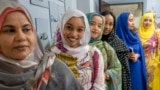 (FILE) Sudanese women in Cairo on Nov. 11, 2024, with their traditional thobes, a gown known for deep-rooted form of cultural expression across Sudan and South Sudan alike. 