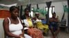 Pregnant women watch television as they wait in the pre-natal ward at Princess Christian Maternity Hospital in Freetown, Sierra Leone, September 10, 2010.