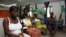 Pregnant women watch television as they wait in the pre-natal ward at Princess Christian Maternity Hospital in Freetown, Sierra Leone, September 10, 2010.