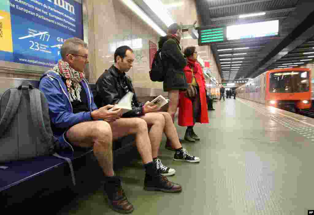 Participants read a book as they wait to take the metro, during the &#39;No Pants Metro Ride&#39; in Brussels, Belgium.&nbsp;