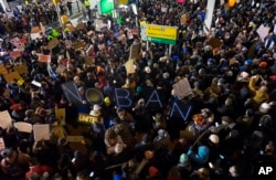 Protesters assemble at John F. Kennedy International Airport in New York, Jan. 28, 2017, after earlier in the day two Iraqi refugees were detained while trying to enter the country.