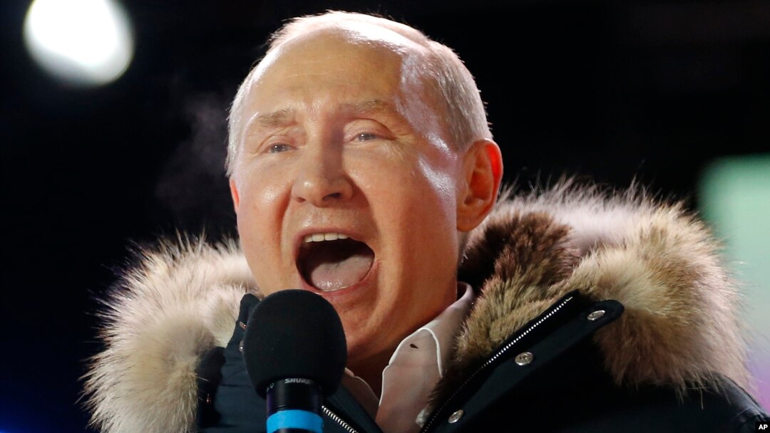 Russian President Vladimir Putin speaks to supporters during a rally near the Kremlin in Moscow, March 18, 2018.
