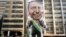 Supporters of Jair Bolsonaro, presidential candidate for the National Social Liberal Party who was stabbed during a campaign event days ago, exhibit a large, inflatable doll in his image in Sao Paulo, Brazil, Sept. 9, 2018.