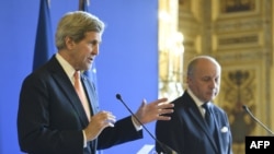 French Foreign Affairs Minister Laurent Fabius, right, U.S. Secretary of State John Kerry at joint press conference, Paris, March 7, 2015.