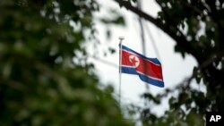 The North Korean flag flies above the North Korean Embassy in Beijing, April 20, 2017. The South Korean news agency says North Korea has detained a third U.S. citizen.