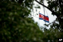 FILE - The North Korean flag flies above the North Korean Embassy in Beijing, April 20, 2017.