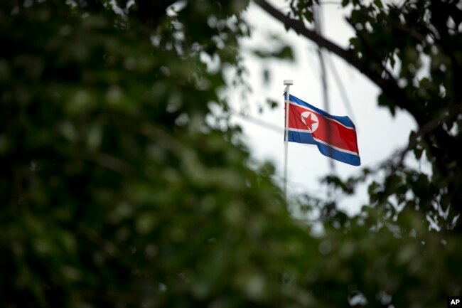 FILE - The North Korean flag flies above the North Korean Embassy in Beijing, April 20, 2017.