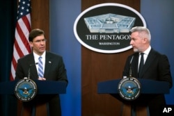 Secretary of Defense Mark Esper, left, and Italian Minister of Defense Lorenzo Guerini take part in a joint press conference, Jan. 31, 2020, at the Pentagon in Washington.