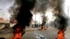 Sudanese protesters use burning tires to erect a barricade on a street, demanding that the country's Transitional Military Council hand over power to civilians, in Khartoum, Sudan, June 3, 2019.