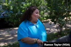 Mexico-native Bernadina Rodriguez, a Houston Walmart baker, says her greatest fear is to pick up the phone to bad news regarding her sons, who work in construction.
