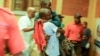 In this image taken from video, people assist victims after two explosions hit a rally of M23 rebel group leaders and residents in Bukavu, Democratic Republic of Congo, on Feb. 27, 2025.