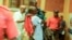 In this image taken from video, people assist victims after two explosions hit a rally of M23 rebel group leaders and residents in Bukavu, Democratic Republic of Congo, on Feb. 27, 2025.
