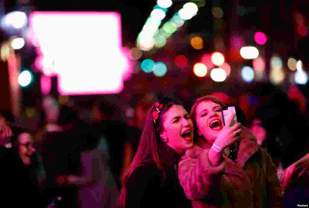 Revellers enjoy themselves during Hogmanay celebrations in Edinburgh, Scotland, Dec. 31, 2017.