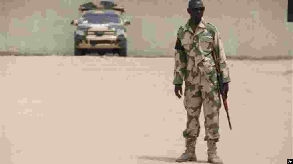 A soldier stands guard at a military base in Maiduguri, Nigeria.